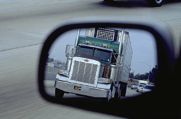 Truck in rear view mirror